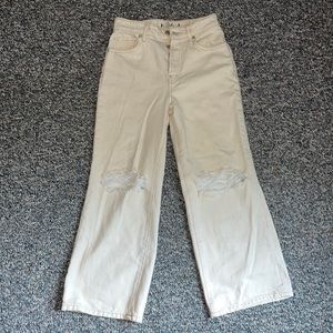 Cream colored free people cropped, distressed jeans